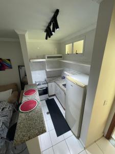 Η κουζίνα ή μικρή κουζίνα στο The Belluno apartamento completo e aconchegante
