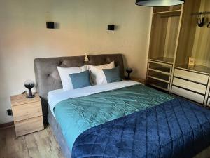 Un pat sau paturi într-o cameră la Hoeve Hooierzele