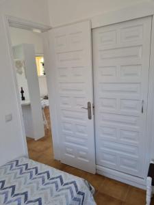 A bed or beds in a room at Bungalow Santa Fe de 2 habitaciones