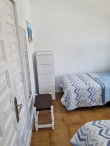 A bed or beds in a room at Bungalow Santa Fe de 2 habitaciones