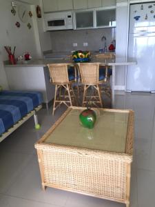 a kitchen with a table with a green apple on it at Playa Parguito Margarita in Aricagua