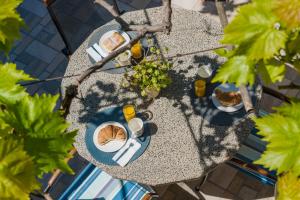 an overhead view of a table with plates of food at Apartment Ruzica in Dubrovnik