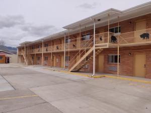 a building with stairs on the side of it at Skyline Motor Inn in Cody