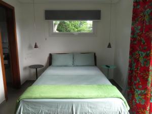 Giường trong phòng chung tại Pátio Floriparadise