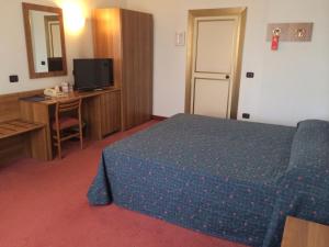 Postel nebo postele na pokoji v ubytování Hotel Arcobaleno