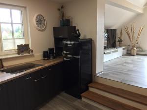 Kuchyň nebo kuchyňský kout v ubytování Ferienwohnung Schwalbennest-Großkoschen