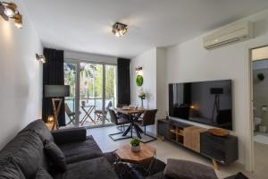a living room with a couch and a table at Lucky Apartment Omiš in Omiš