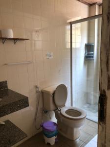 a bathroom with a toilet and a shower at Pousada de Ubu in Anchieta +45 photos