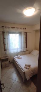 Ένα ή περισσότερα κρεβάτια σε δωμάτιο στο Evgenia's House