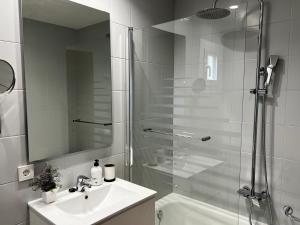 a bathroom with a shower and a sink and a toilet at Casa Coromines in Alcudia