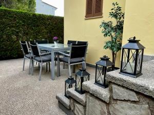 a table and chairs on a patio with lights at Casa Coromines in Alcudia