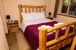 Кровать или кровати в номере Loxleys Lodge