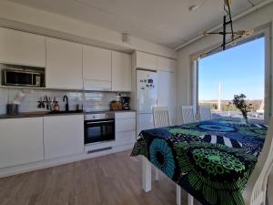 A kitchen or kitchenette at 62m2 10th floor modern apartment with sauna and view