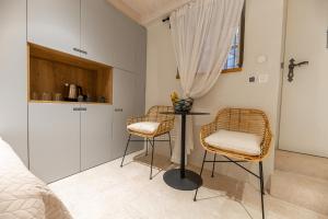 a small table and two chairs in a bedroom at Superior Room Gabriela in Dubrovnik