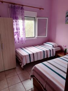 Postel nebo postele na pokoji v ubytování Αξέχαστη διαμονή - Unforgettable accommodation