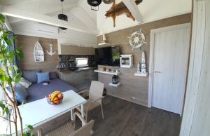 a caravan with a kitchen and a living room at House Kalmia in Fonyód +21 photos