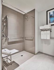 a shower with a glass door in a bathroom at Hyatt House Davis in Davis