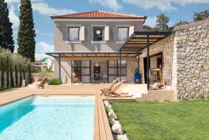 a house with a swimming pool in front of a house at Casa Sol in Zadar