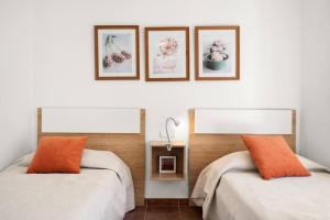 Una cama o camas en una habitación de Villa Santa Helena