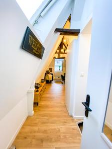 an attic hallway with a sign that reads melbourne at **NEW** Le Nid Douillet au cœur de Guingamp in Guingamp