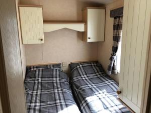 Hylton Park Silloth Caravan Holiday Homes客房内的一张或多张床位