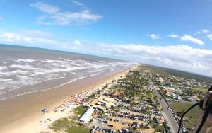 an aerial view of a beach and the ocean at Vi&Li Suites in Aracaju