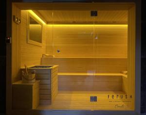 a bathroom with a sauna in a wooden room at Ferush Boutique Hotel in Urla