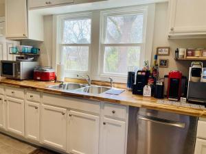 a kitchen with a sink and a counter top at Bountyland Cottage - Lake Keowee - Mountains - Clemson University in Seneca