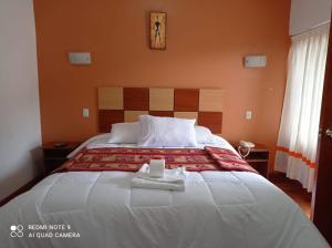 Postel nebo postele na pokoji v ubytování Tierra del Inka