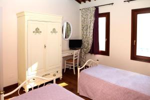 Postel nebo postele na pokoji v ubytování B&B "Corte San Tomaso"