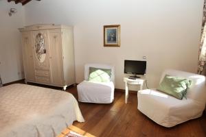 TV a/nebo společenská místnost v ubytování B&B "Corte San Tomaso"
