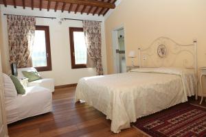 Postel nebo postele na pokoji v ubytování B&B "Corte San Tomaso"