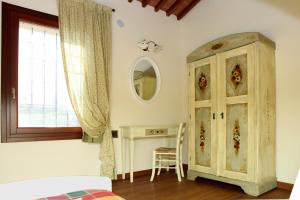 Postel nebo postele na pokoji v ubytování B&B "Corte San Tomaso"