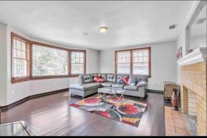 a living room with a couch and a fireplace at Comfy pet friendly home in Jacksonville mins to downtown’s in Jacksonville