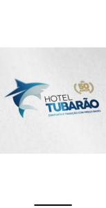 logotipo de hotel lugano sobre fondo blanco en Hotel Tubarao, en Tubarão