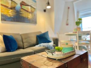 a living room with a couch and a coffee table at The Loft at Charlotte's Rose in Charlottetown