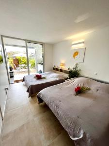 Postel nebo postele na pokoji v ubytování NOUVEAU studio chaleureux avec jacuzzi privé & piscine