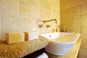 a bathroom with a large white tub on a counter at Agriturismo Il Gelso Antico in Recanati