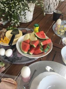 a table with two plates of fruit on a table at Bed&Breakfast M&M in Kungsbacka