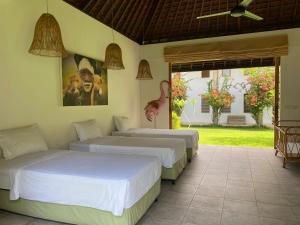 Un ou plusieurs lits dans un hébergement de l'établissement Balian Prana