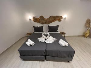 Posteľ alebo postele v izbe v ubytovaní Mykonian Tramonti Villas