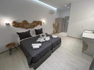 Posteľ alebo postele v izbe v ubytovaní Mykonian Tramonti Villas