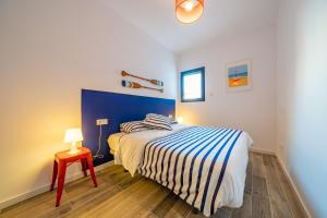 Postel nebo postele na pokoji v ubytování CAN MARTINEZ Calella Beach Boutique Apartment