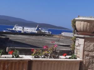 a view of a harbor with a boat in the water at Marmari vacation flat in Marmarion