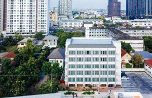 an aerial view of a white building in a city at VST Punnawithi - SHA Certified in Bangkok