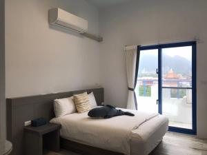 Postel nebo postele na pokoji v ubytování Memories Homestay