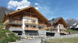 a large building with balconies on a mountain at TERRESENS - Les Améthystes in Vaujany