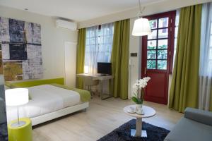 a bedroom with a bed and a desk with a computer at Casa Ganci in Turin