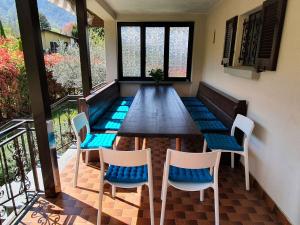 a dining room with a table and chairs at Holiday Home near Lago Maggiore Pool in Porto Valtravaglia