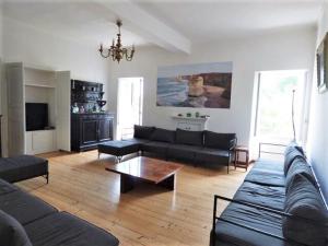 a living room with a couch and a coffee table at Holiday Home near Lago Maggiore Pool in Porto Valtravaglia